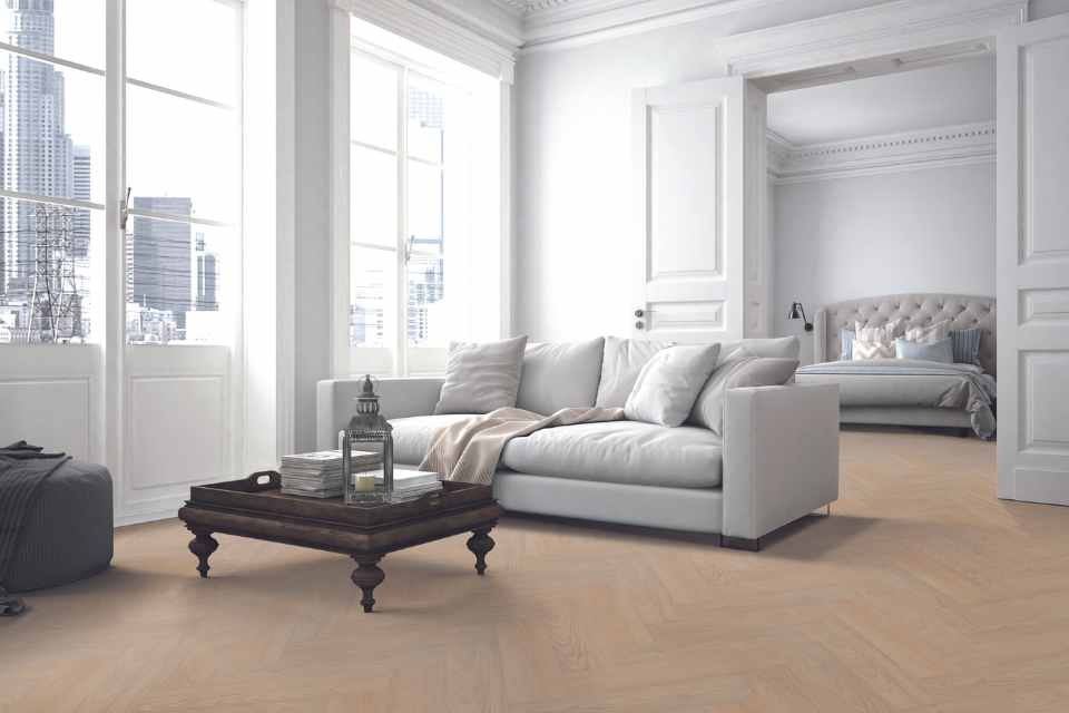light white oak luxury vinyl in herringbone in white living room with pocket doors to bedroom